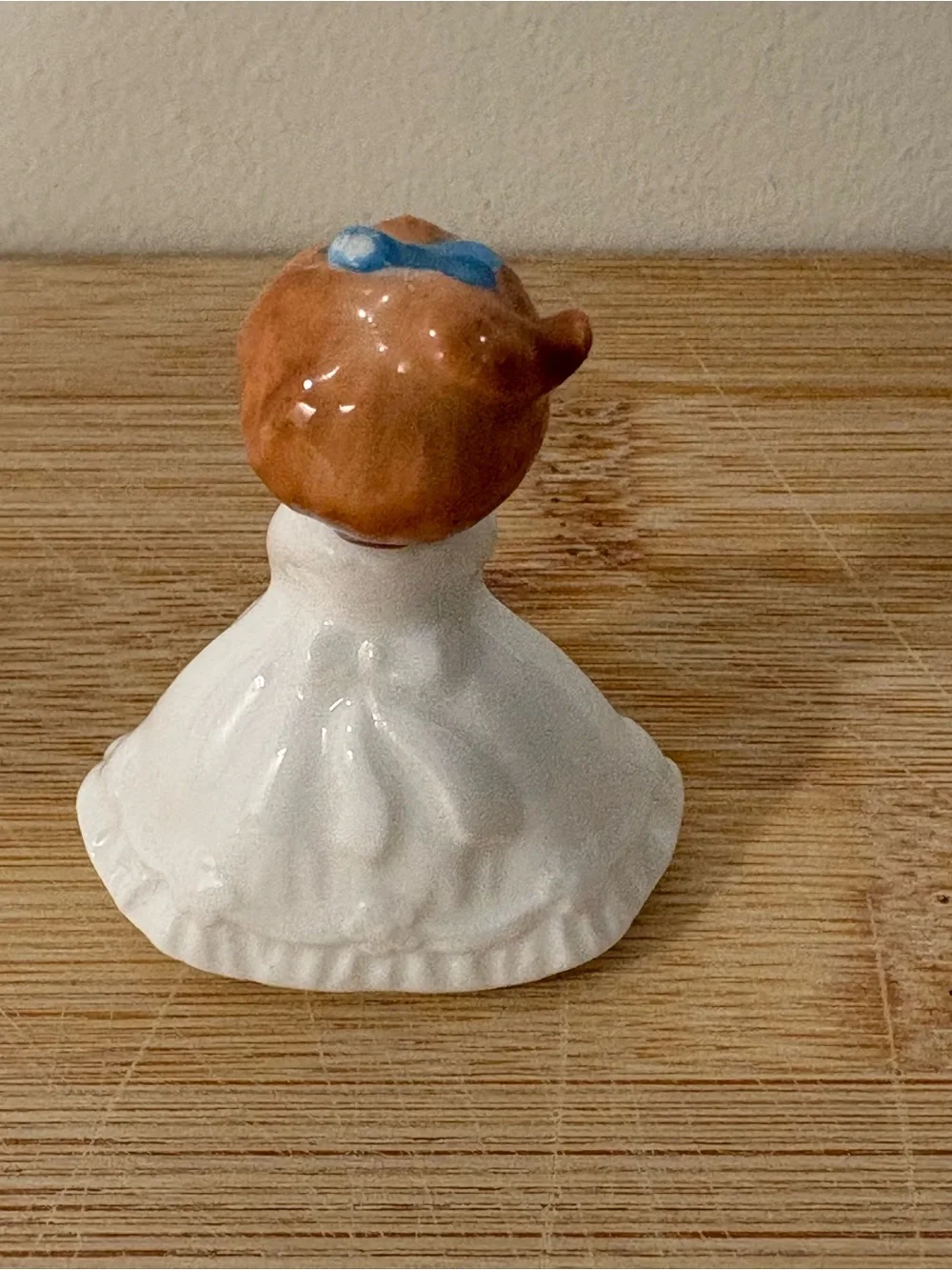 Napcoware September Ceramic Birthday Girl Figurine with Blue Bow and Pink Flower